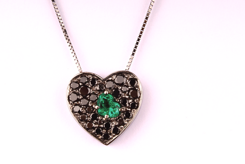 " An Emerald Heart inside a pavè of Black Diamonds "